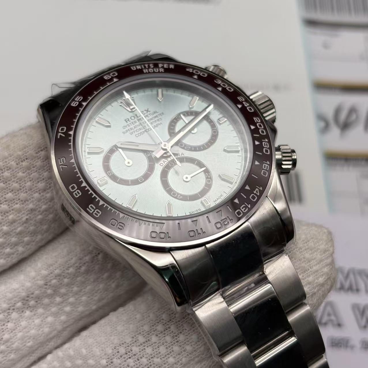 eb21a257fd94fde7d27d59136d24fc79 Close-up of Rolex Daytona replica dial with chronograph subdials and luminous markers