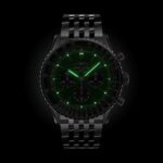 Breitling Navitimer replica green dial on wrist with stainless steel strap